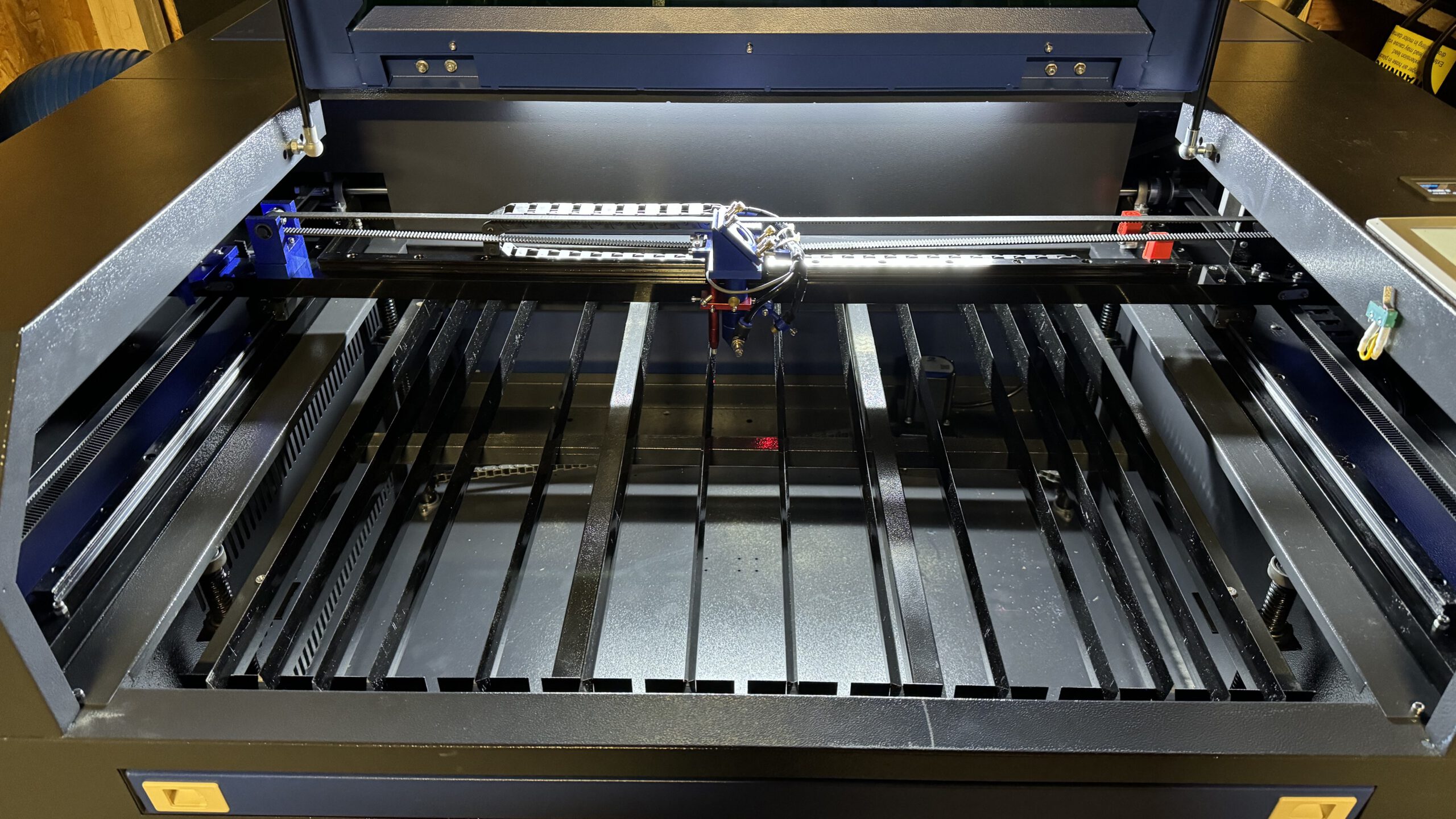 Interior view of a CO2 laser with a knife table to prevent smoke marks on the underside of the workpiece