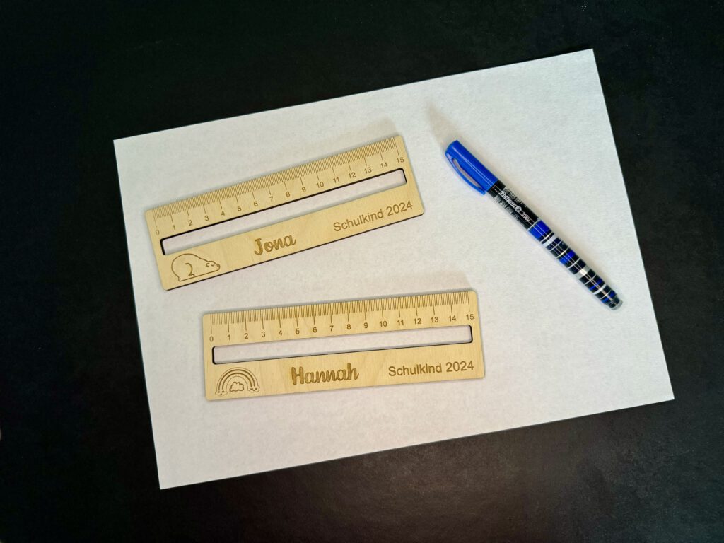 Image of finished rulers with pen and paper
