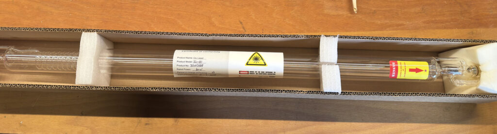 CO2 laser tube in a shipping box with styrofoam padding.

